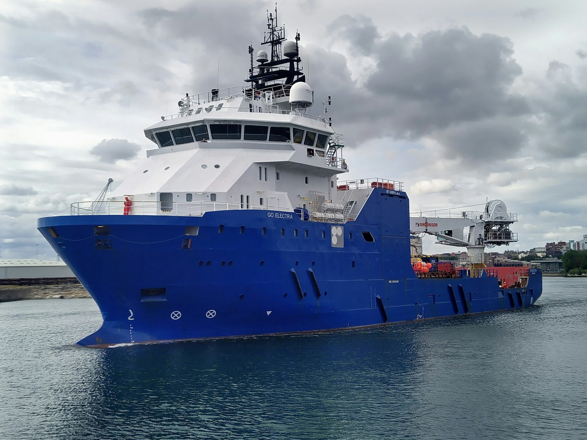 Offshore supply vessel entering port
